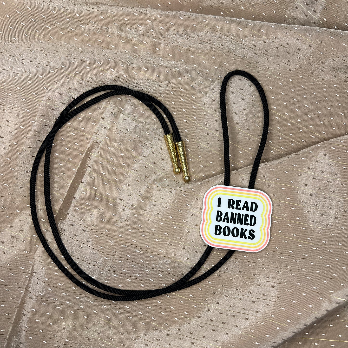 I read banned books handmade bolo tie (warm colors)