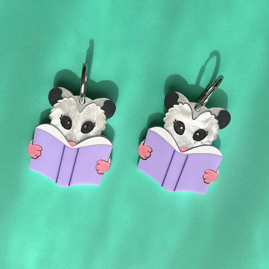 Reading opossum earrings